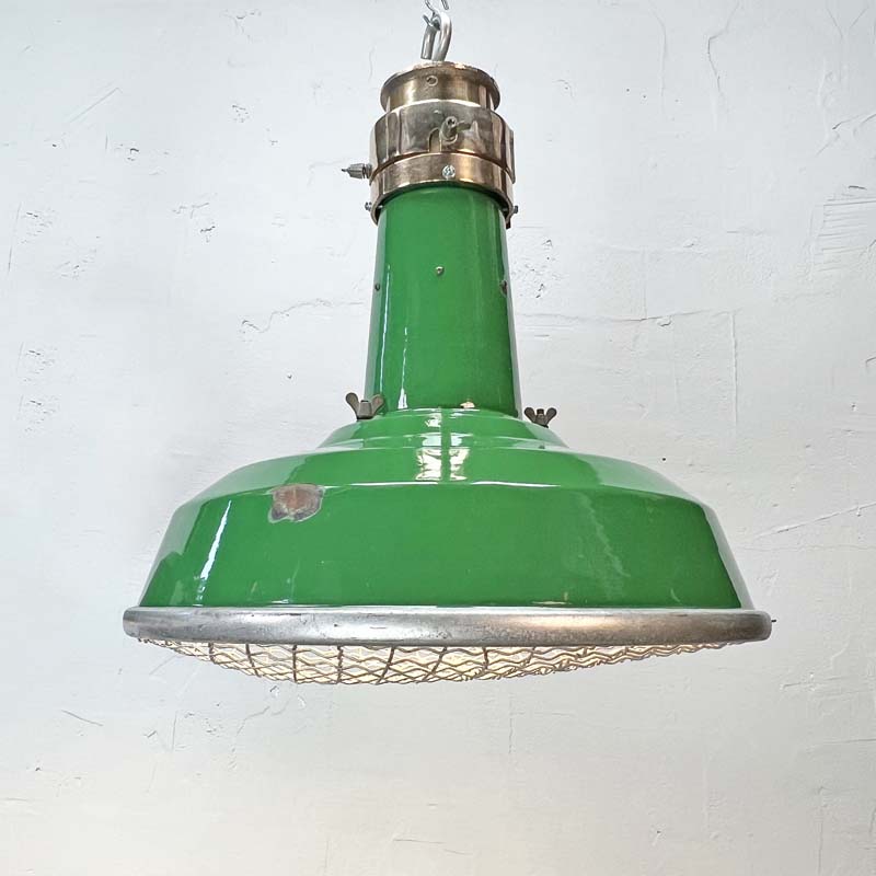 A green enamel rustic ceiling light with bronze top section and metal cage made in England by Thorlux circa 1940.