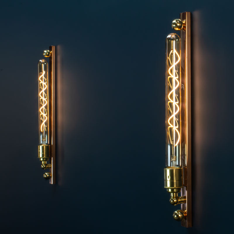 The new copper and brass linear wall light features an LED Edison tube. A modern industrial wall fixture with worldwide shipping available