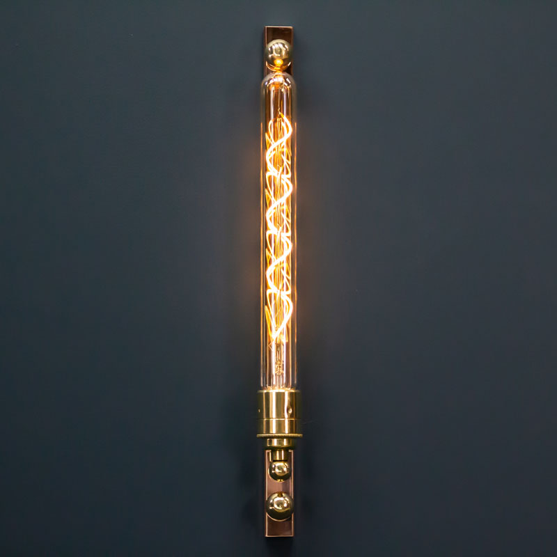 The new copper and brass linear wall light features an LED Edison tube. A modern industrial wall fixture with worldwide shipping available