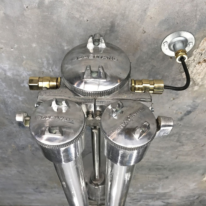 A vintage industrial twin T8 flameproof wall strip light, restored for modern interiors. An industrial style wall light with an aluminium body & flameproof glass tubes.